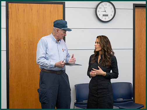 Image of OPP member talking with a constituent 